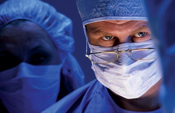 Doctor Examining Patient After Operation